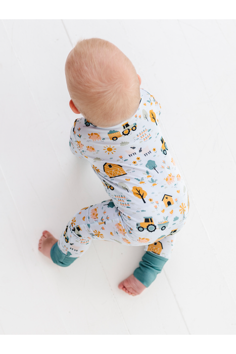 Sawyer Bamboo Fabric Baby Zip Romper  Back View on Crawling Baby - Farm Animals Print by Bird and Bean