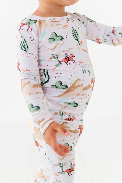 close up of Billy Western Print Kids Pajama Set on standing child model