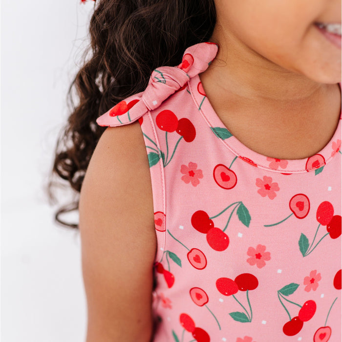 cherry print dress on child by Bird and Bean Kids