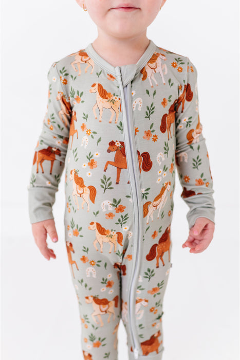 Bamboo One Piece Zip Pajama -Horsin' Around Print Close-up on Child Model _ Bird and Bean Original 
