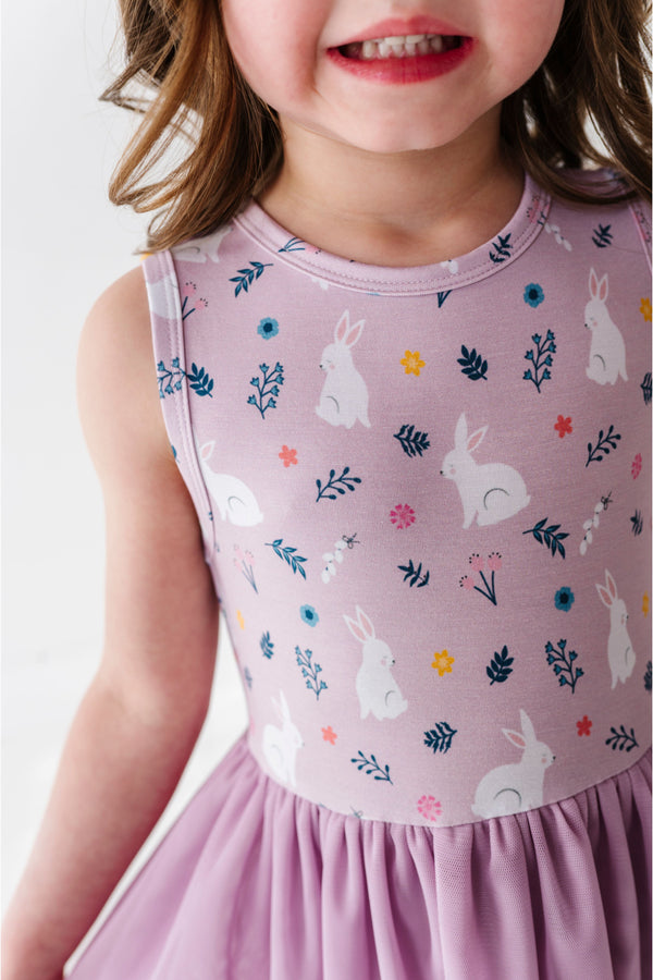 Child wearing a pink dress with bunny and flower pattern and tulle skirt - Bird and Bean