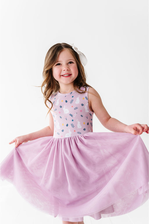 Young girl wearing a pink dress tulle skirt  with a white background Bird and Bean Kids 