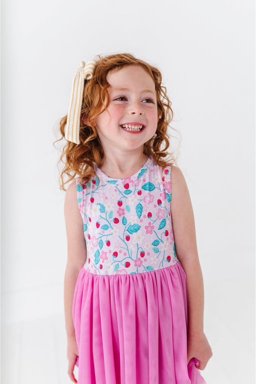 Strawberry print dress with bright pink tulle skirt on cute little girl