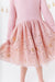 Pink holiday dress with a sequined skirt on a white background | Bird and bean 
