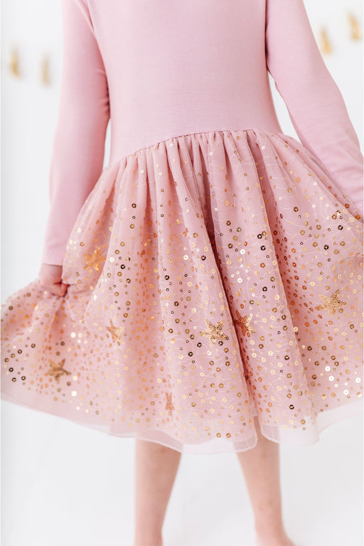 Pink holiday dress with a sequined skirt on a white background | Bird and bean 