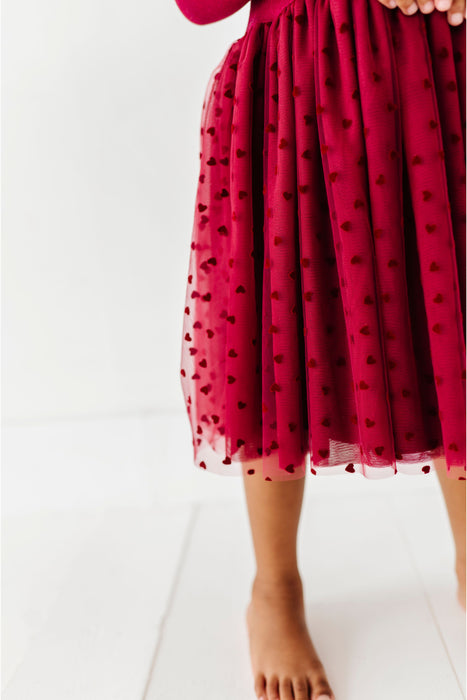Red polka dot dress on a white background | Bird and Bean 