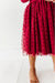 Red polka dot dress on a white background | Bird and Bean 