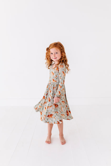 Young girl wearing a twirly floral dress - Bird and Bean Bamboo Dresses for Kids