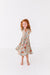 Young girl wearing a twirly floral dress - Bird and Bean Bamboo Dresses for Kids