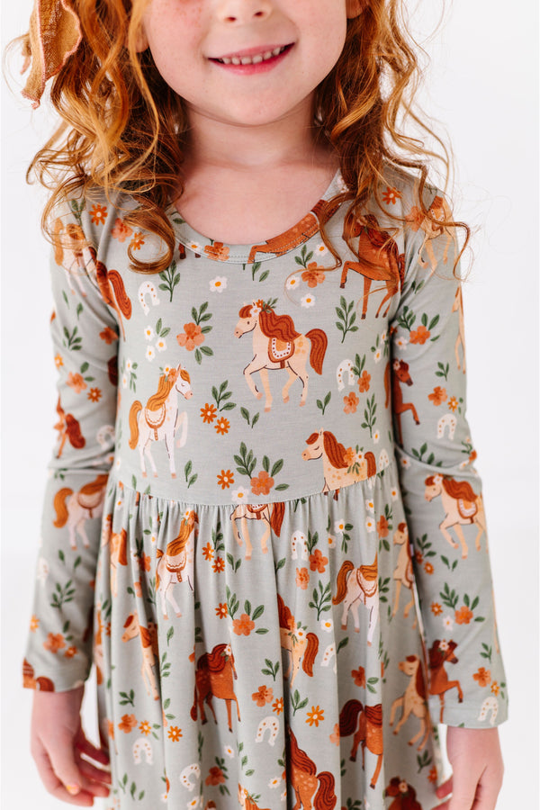 Child wearing a bamboo dress with horse and floral pattern - Bird and Bean Original