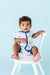 Baby Model sitting in chair wearing Bamboo Kai Sailboat Baby Shortie Romper Onesie