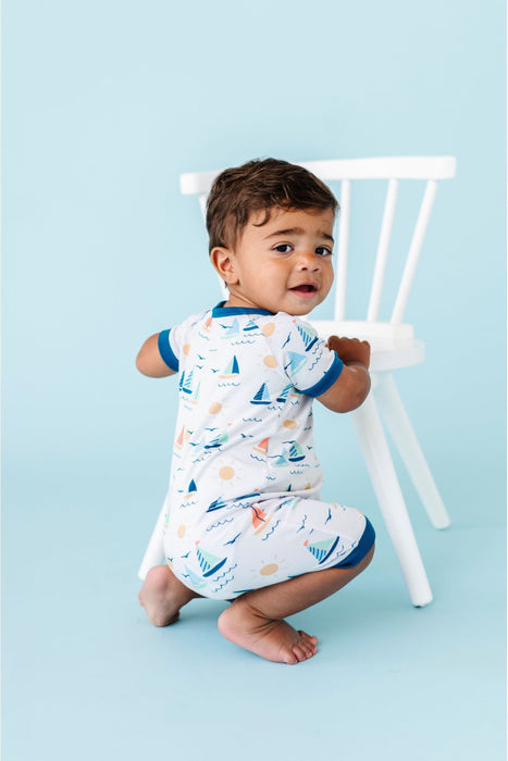 Baby Model crouching, Wearing Bamboo Kai Sailboat Baby Shortie Romper Onesie