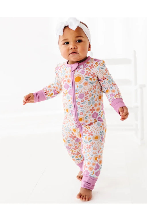 Baby wearing floral pink zip bamboo pjs