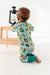 Back view of Baby model wearing bamboo zip up pajamas featuring bright, adorable illustrated adventure merit patches in Let's Explore print