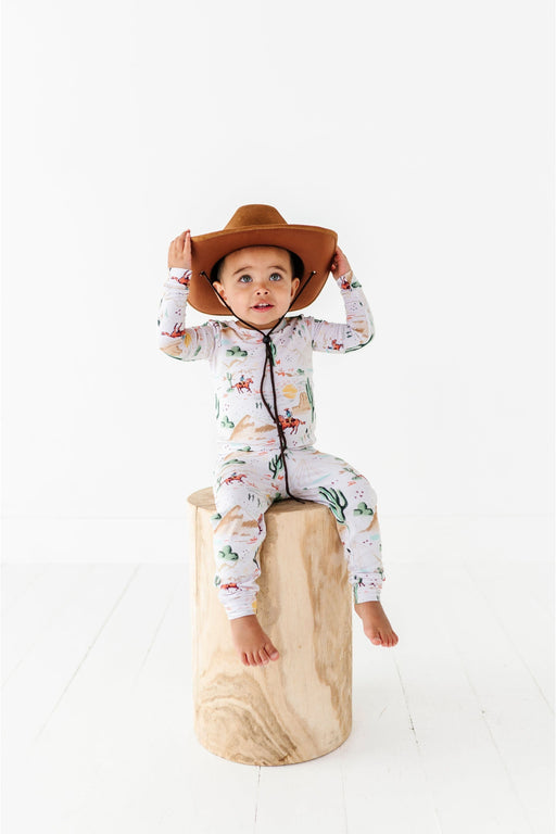 Billy Western Print Kids Pajama Set on sitting child model wearing cowboy hat