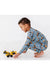 Boy model playing with toy trucks, in blue bamboo Construction Worksite truck pajamas