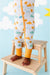 Close up of baby model standing in Sunny Sunshine Convertible Bamboo Zip Romper Sleeper Onesie with Marigold Cuffs
