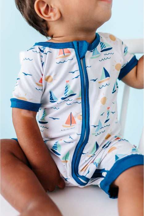 Close up of baby model wearing Bamboo Kai Sailboat Baby Shortie Romper Onesie