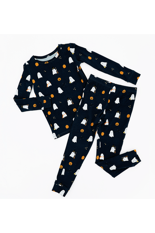 Children's pajama set with ghost and pumpkin pattern on a white background