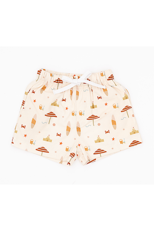 Beige  boys swim shorts with beach-themed pattern on a white background Bird and Bean Kids