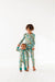 Two kid models wearing coordinating bamboo pajamas featuring bright, adorable illustrated adventure merit patches in Let's Explore print