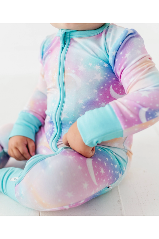 close up of astra one piece zip romper on baby model