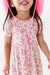 close up of girl model wearing Dixie Cowboy Western Pink Bamboo Short Sleeve Dress